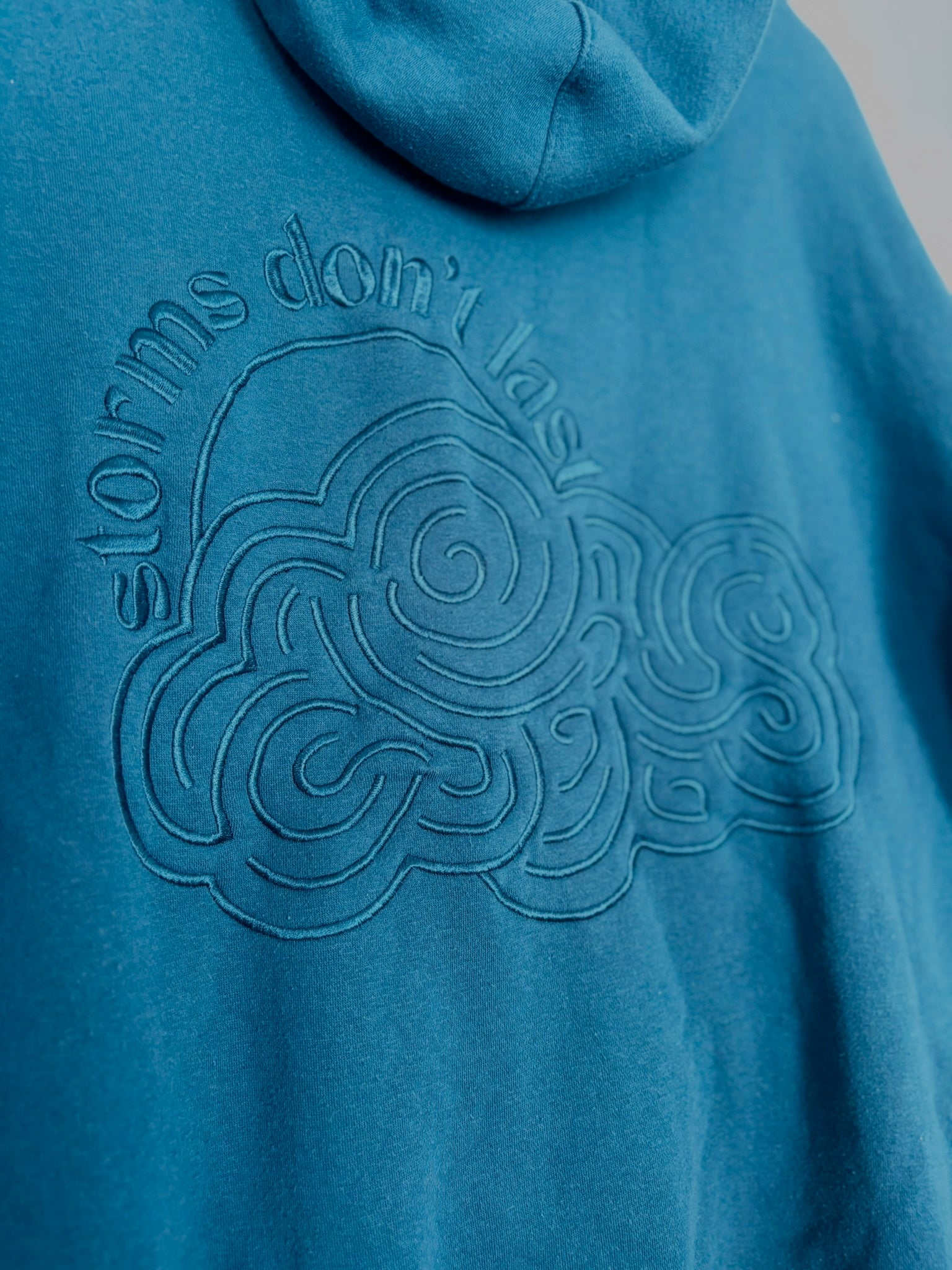 Storms Don't Last Hoodie Dark Cyan