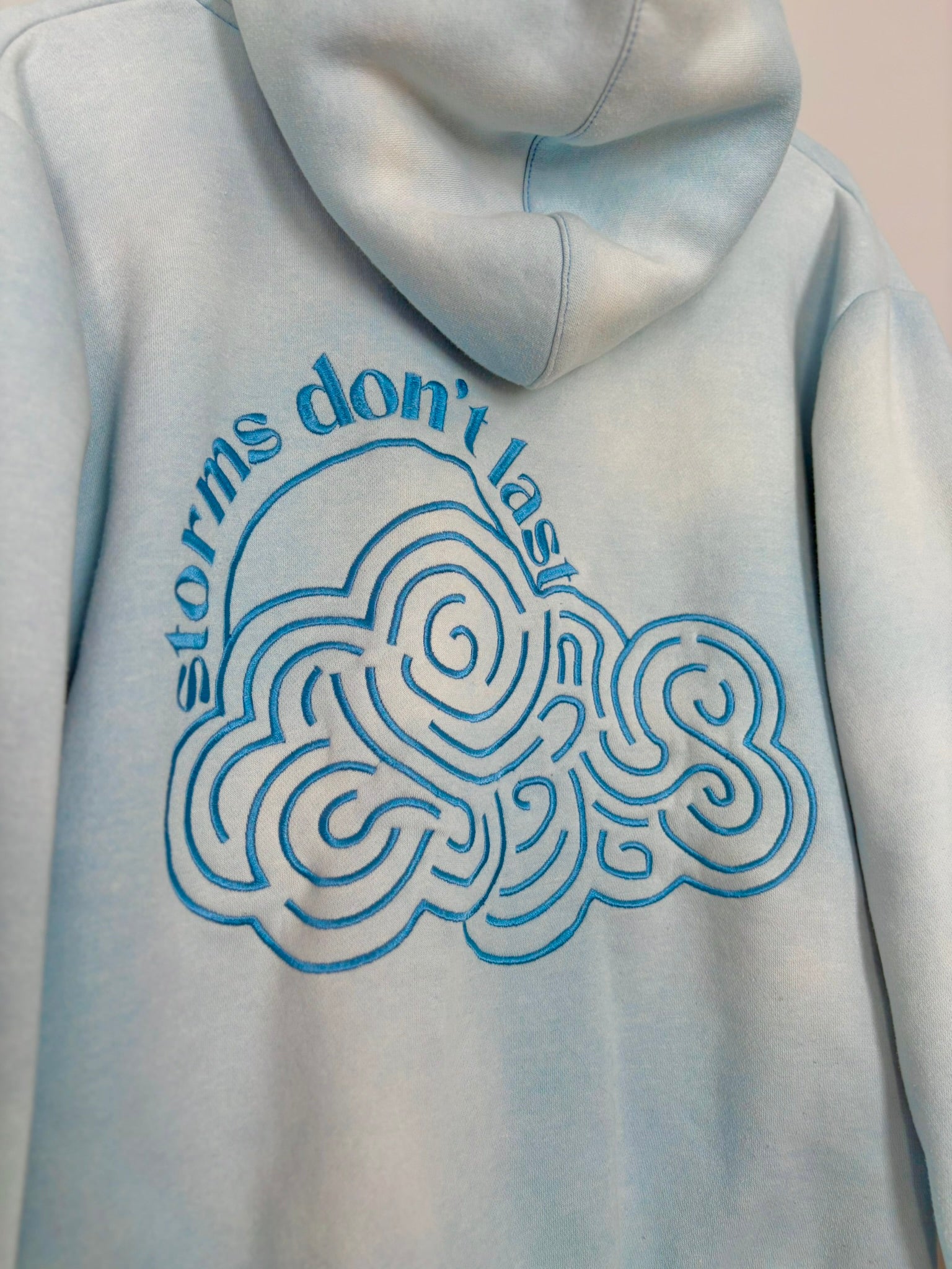 Storms Don't Last Hoodie Light Blue Sunfade